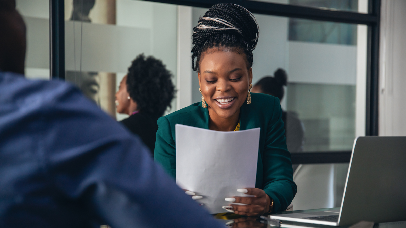 A business woman conducting an interview to hire a temporary employee.