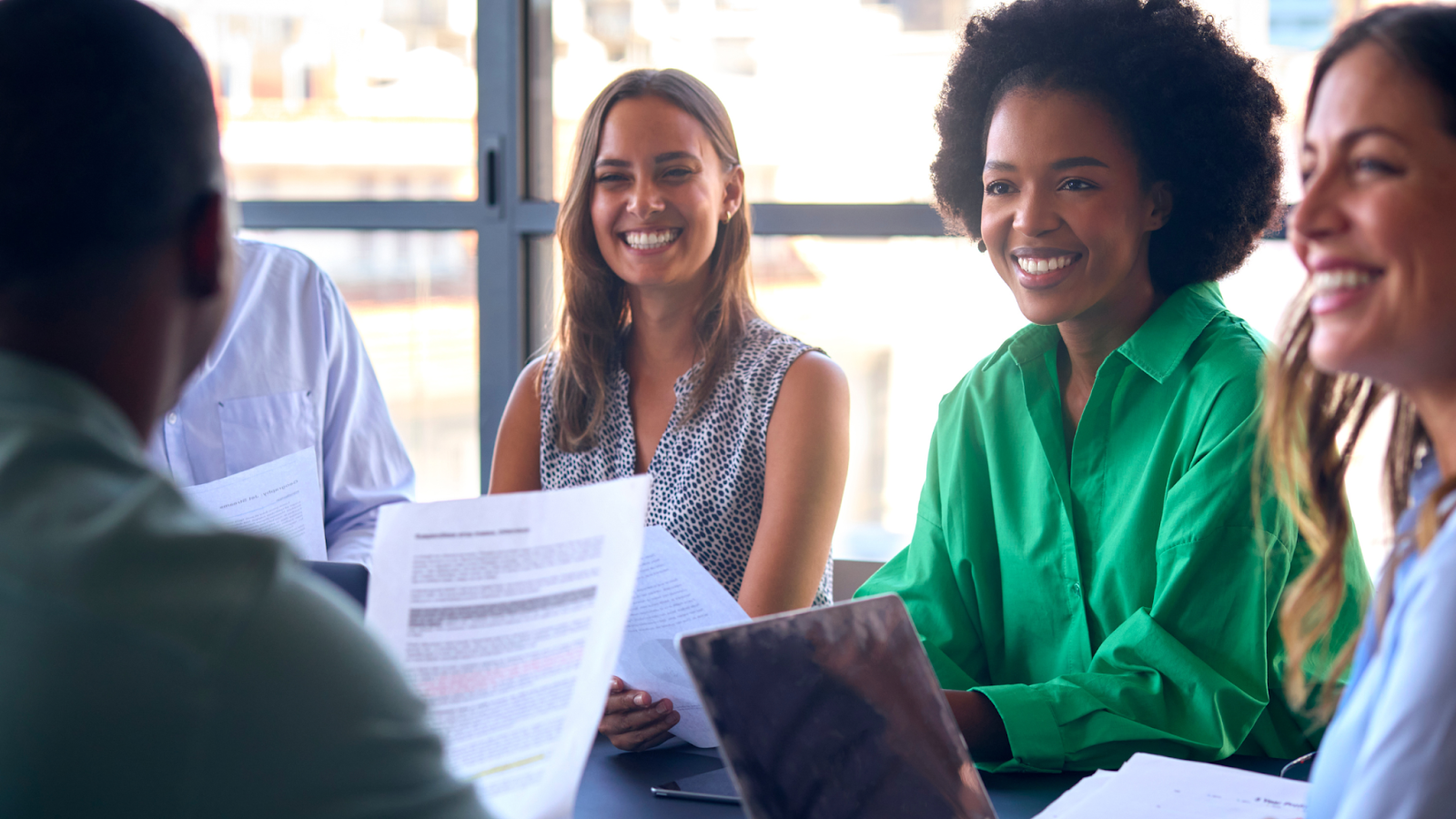 Happy team members work together during a meeting