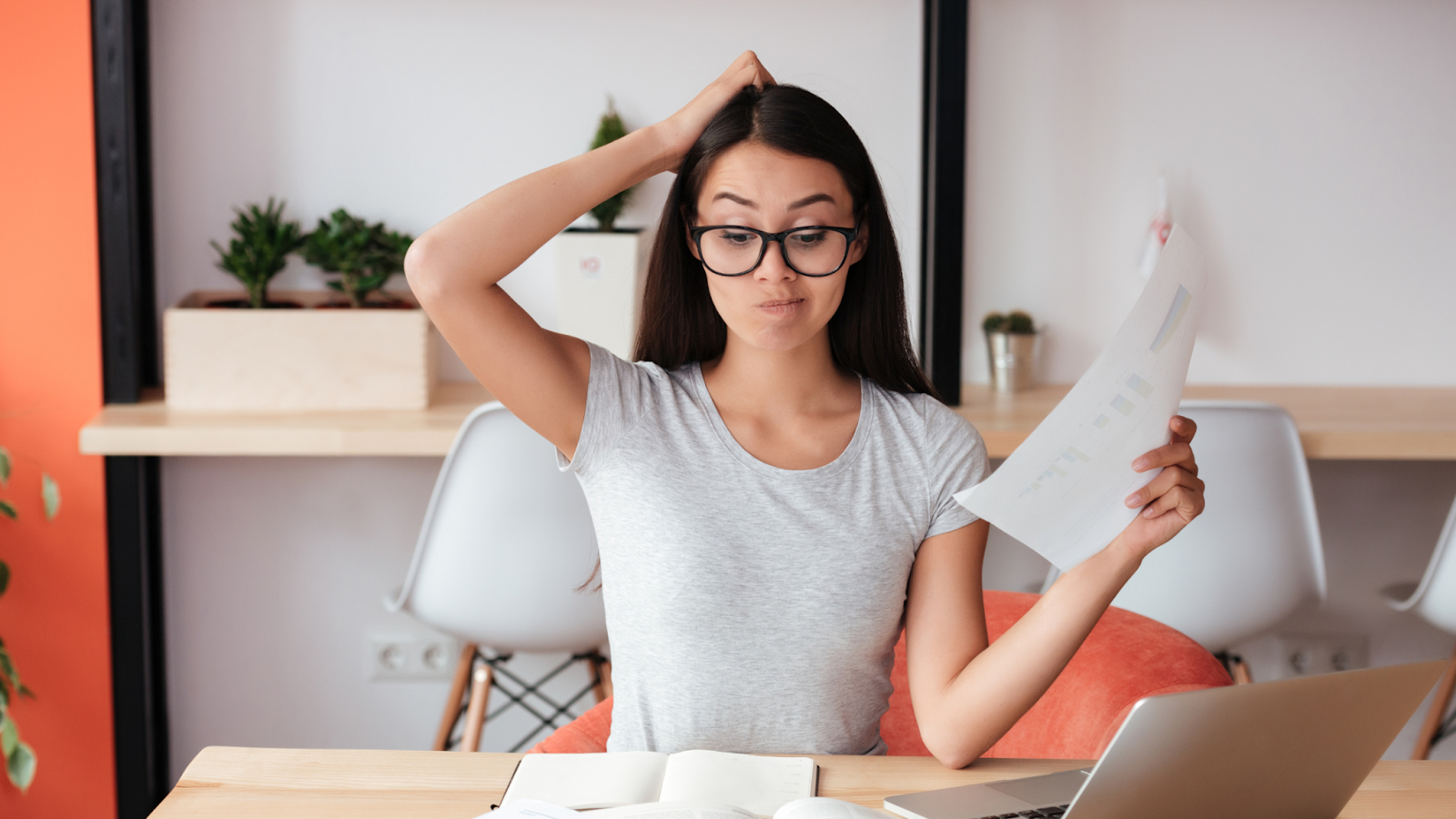 A hiring manager scratches her head, trying to prepare an interview for positions she does not understand